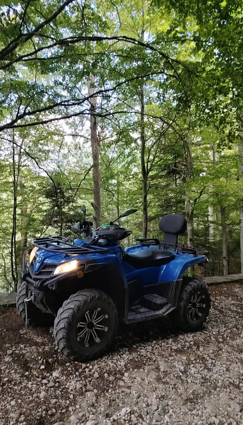 Blue CFMOTO ATV in the forest along Calea Codrului, Sinaia