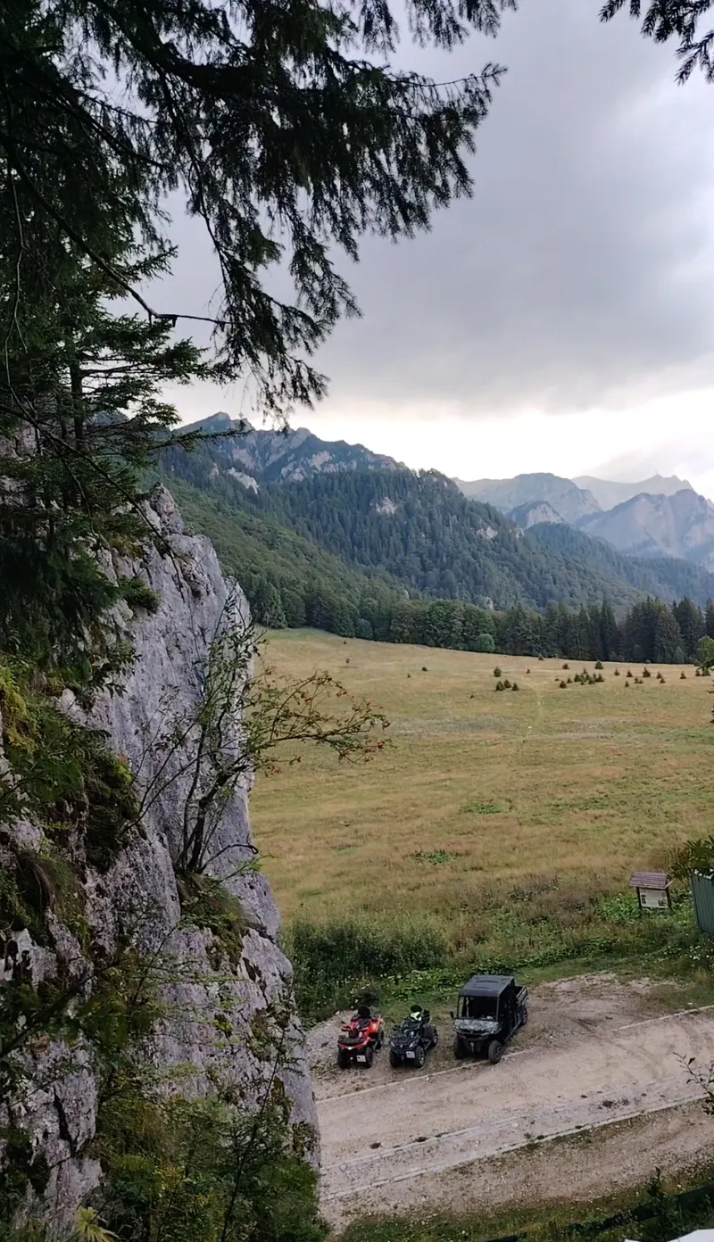 ATVs in a mountain meadow with the Bucegi Mountains, combined trail Sinaia