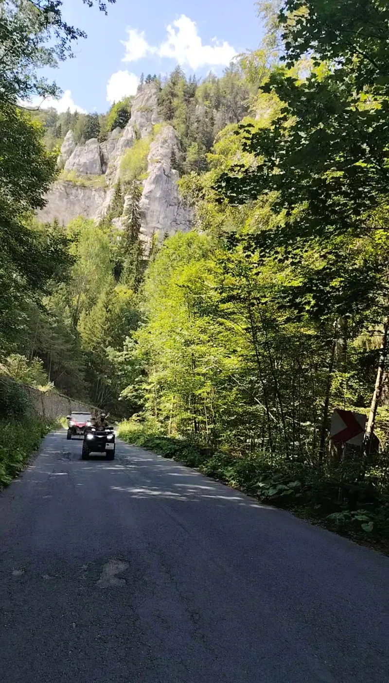 ATV tour on the Calea Codrului trail with cliffs in the background, Sinaia